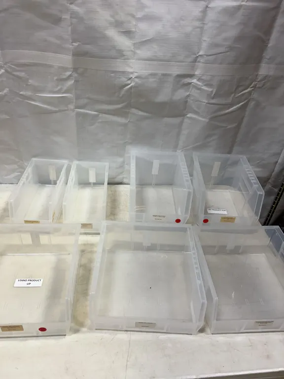 Seven Clear Plastic Stackable Storage Bins