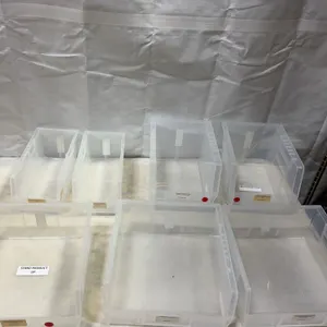 Seven Clear Plastic Stackable Storage Bins
