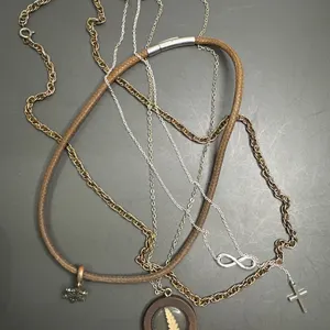 Necklaces with Various Materials, Including Leather, Metal, and Resin