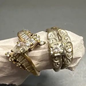 Two Women's Rings Featuring Gold and Silver Tones with Clear Stones