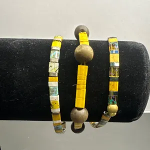 Three Beaded Bracelets with Yellow and Multicolored Beads