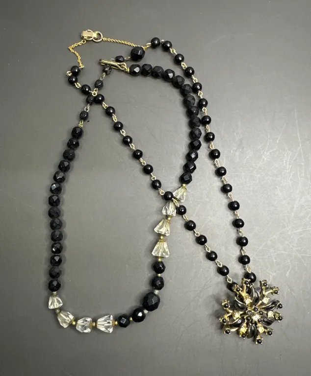 Two-Piece Beaded Necklace Set Featuring Black and Clear Beads