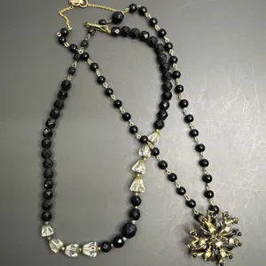 Two-Piece Beaded Necklace Set Featuring Black and Clear Beads