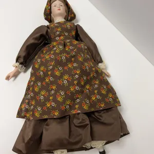 Porcelain Doll in Brown Floral Dress and Bonnet