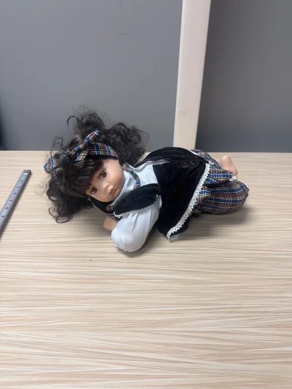 Laying Porcelain Doll