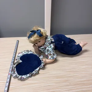 Laying position Porcelain Doll w/ matching pillow