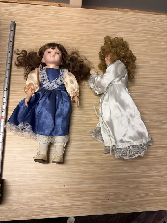 Praying girl & misc. doll