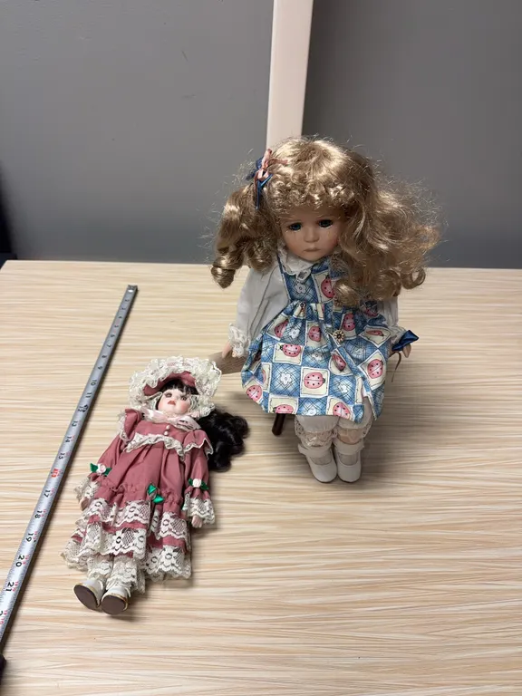 Sad girl in chair / pink dress doll