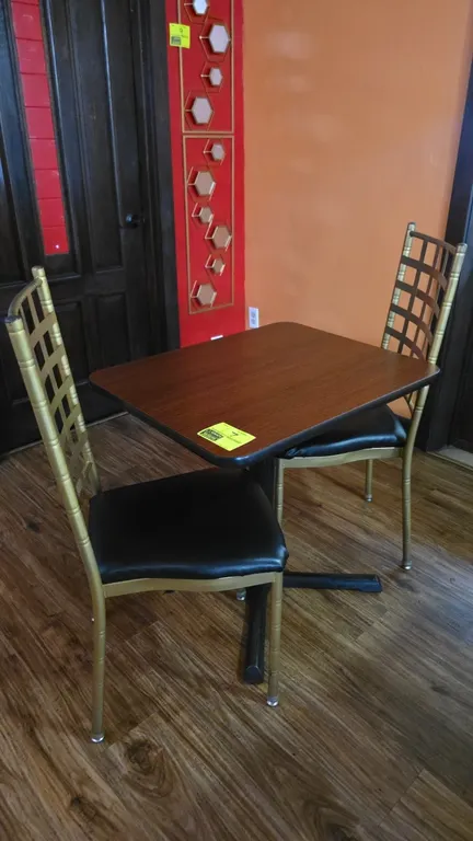 Dining table and chair set. Includes (1) table and (2) matching chairs. Table features a woodgrain laminate top measuring 24" x 30" mounted on a black