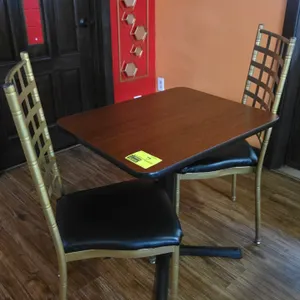 Dining table and chair set. Includes (1) table and (2) matching chairs. Table features a woodgrain laminate top measuring 24" x 30" mounted on a black