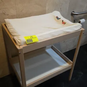 Wood frame diaper changing table. Features an open lower storage shelf and includes a changing cushion with fabric cover. Dimensions: 29" x 21" x 35".