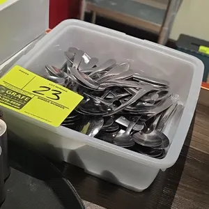 Quantity of stainless steel spoons. Includes translucent poly storage bin. Other items pictured not included.