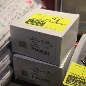 Fischer Paper Products 41703 white napkin bands. Includes (2) boxes of 2,000 count each. Dimensions: 1½" x 4¼". Surrounding items not included.