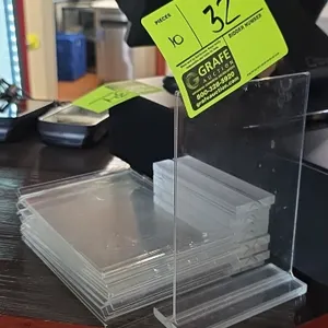 Poly sign stands. Features clear double-sided display frames with slotted clear acrylic bases for tabletop or countertop use.