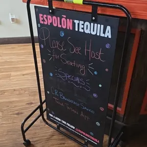 Portable dual-sided metal sign. Features Espolòn Tequila branded chalkboard display panel on a black metal frame. 26" x 42". Mounted on casters.