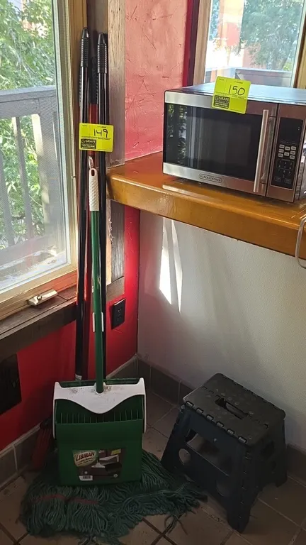 Cleaning supplies and poly step stool lot. Includes Libman lobby dustpan with upright broom, mop, additional broom, and folding plastic step stool. Mi