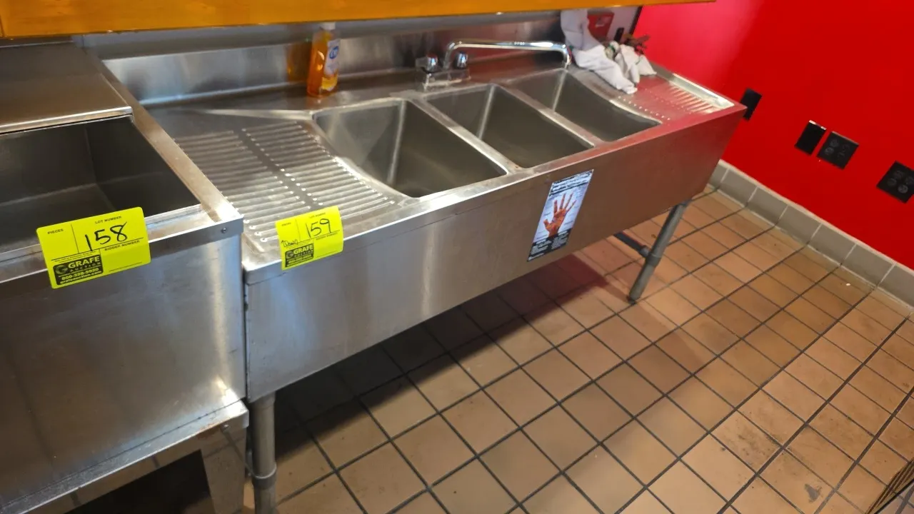 Boos stainless steel 3-compartment undercounter sink. Features (3) deep wells, left and right ribbed drainboards, backsplash, and a splash-mount fauce