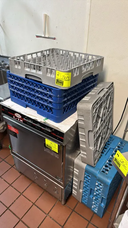 Assorted commercial poly dish racks. Features molded plastic construction in blue and gray, including peg and compartment styles. Undercounter dishwas