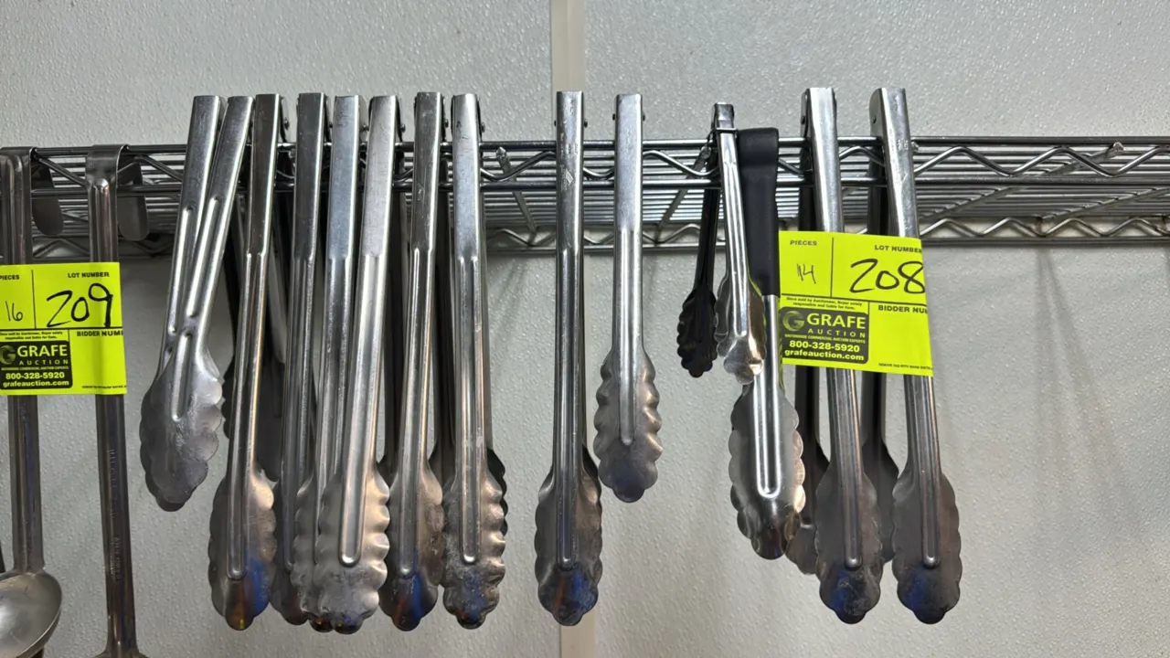 Stainless steel utility tongs. Features scalloped gripping ends in assorted lengths, including one with an insulated handle grip. Wire shelving not in