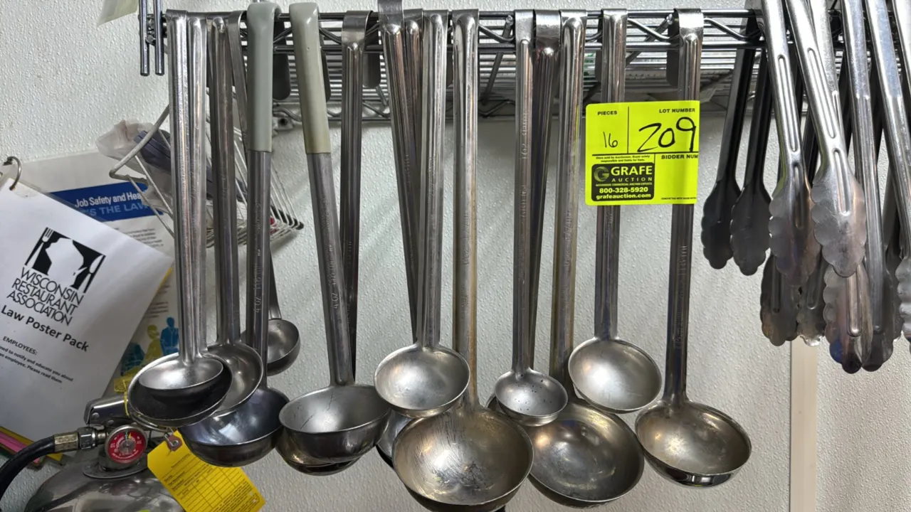 Assorted stainless steel ladles. Features various bowl capacities, hooked handles, and select coated-grip handles. Wire shelving and background items