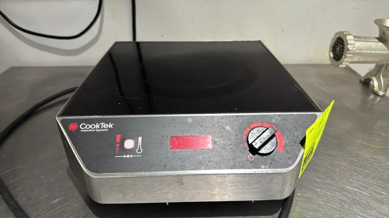 CookTek MC2500 MagnaWave countertop induction cooktop. Features a ceramic glass cooktop, stainless steel housing, rotary control knob, and digital dis