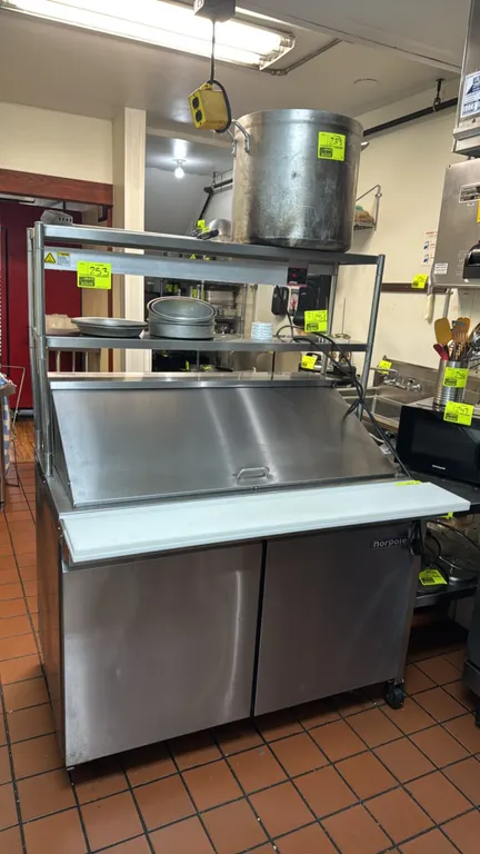 2025 Norpole NP2R-SWMT refrigerated prep table. Features stainless steel construction, 2-tier overshelf, top pan rail with hinged lid, cutting boards,