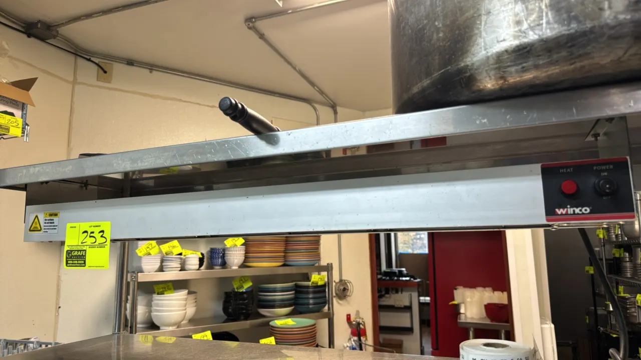 Winco ESH-36 commercial electric infrared strip heater. Features aluminum housing, toggle power switch, heat indicator light, and wire guard. 36"L. S/
