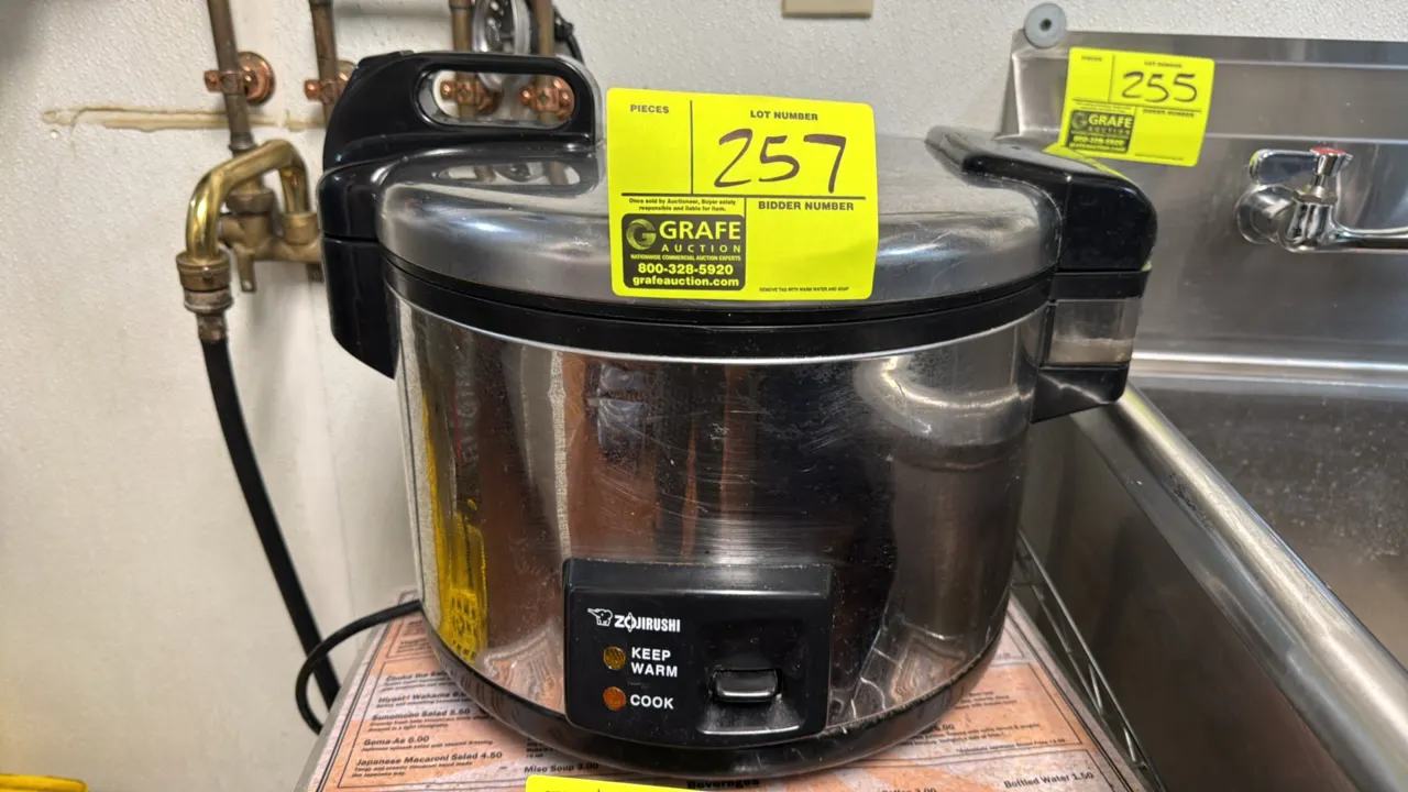 Zojirushi NYC-36 commercial electric rice cooker and warmer. Features stainless steel housing, hinged locking lid, and removable inner pot with capaci