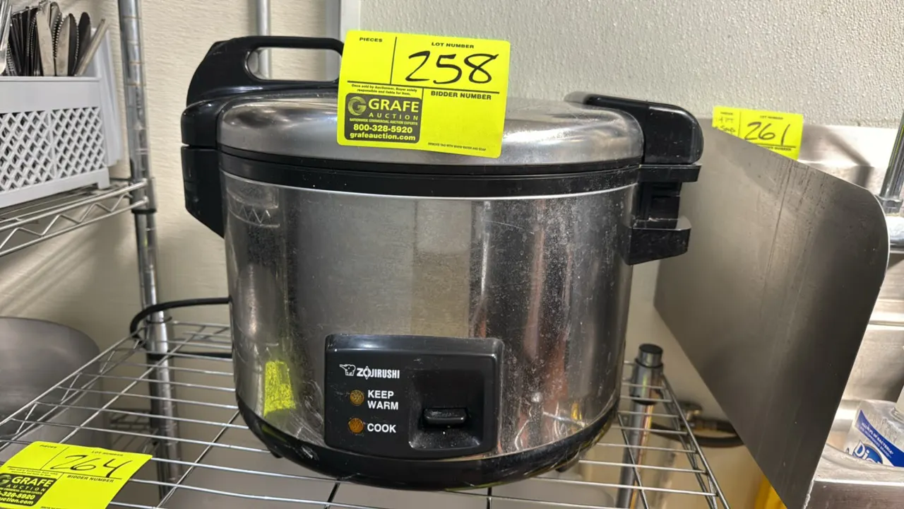 Zojirushi NYC-36 commercial electric rice cooker and warmer. Features a stainless steel exterior, hinged lid, and cook and keep warm settings. Electri