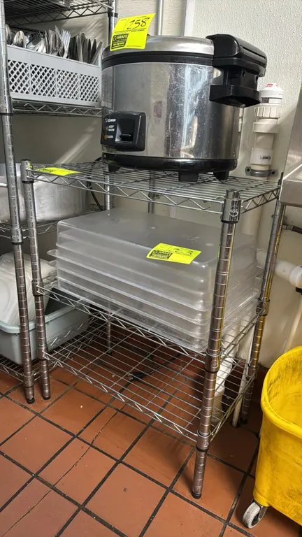 Chrome 3-tier wire shelving rack. Features adjustable wire shelves and leveling feet. 24" x 14" x 31". Contents not included.