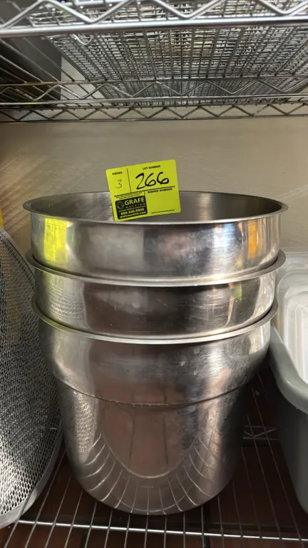 Stainless steel soup insert pans. Features round inset design with stepped sides and rimmed lip. Dimensions: 11" x 9".