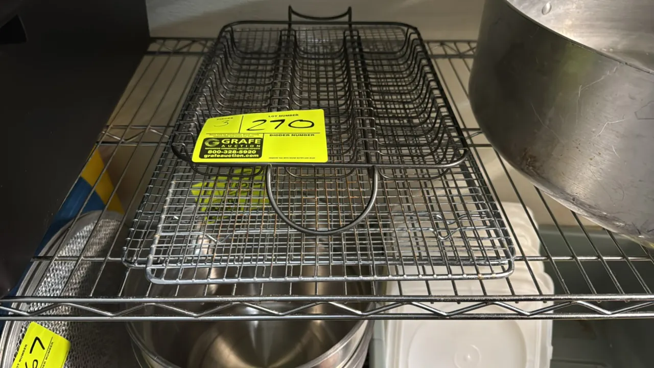 Assorted wire cooking and cooling racks. Includes a wire roasting rack with handles and wire pan cooling grates. Chrome-plated wire construction.