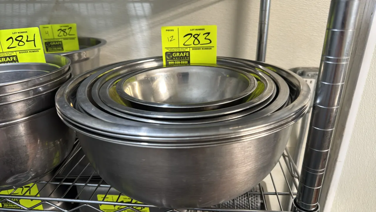 Stainless steel mixing bowls. Features rolled rims and nesting design. Dimensions: 7" to 13" diameter.