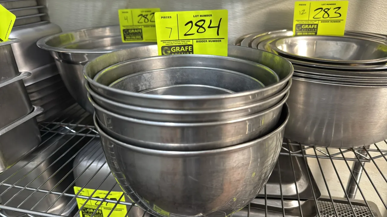 Stainless steel bowls. Features nested design with rolled rims. Dimensions: 5" to 9".