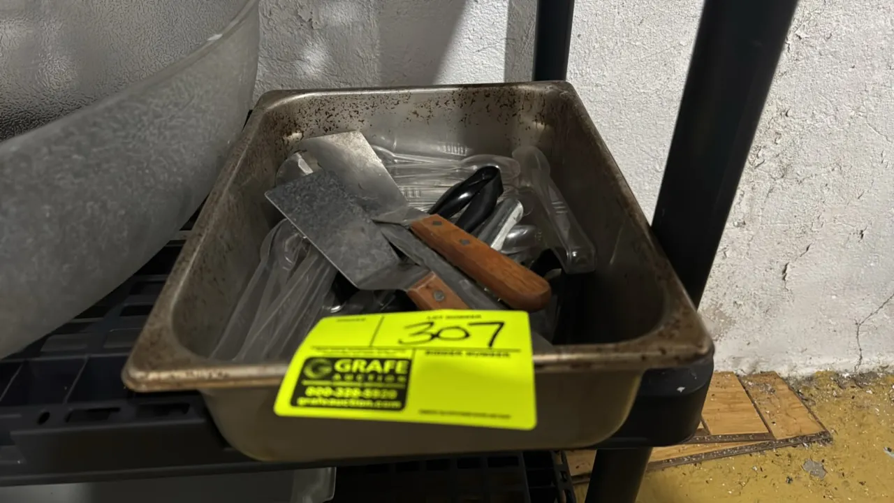 Package lot of assorted kitchen smallwares with stainless steel insert pan. Includes wood-handled metal turners, tongs, and clear plastic serving uten