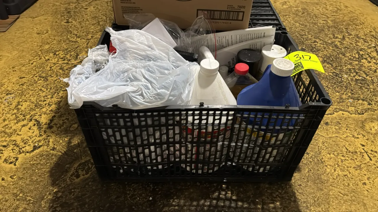 Package lot of assorted cleaning supplies with plastic tote. Includes chemical jugs, spray bottles, cleaning liquids, bagged hardware components, and