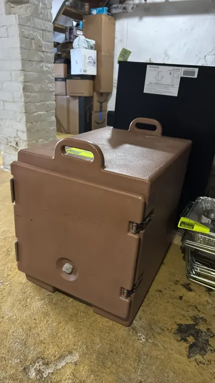 Cambro insulated transport cabinet. Features brown polyethylene construction, single hinged door with dual metal draw latches, molded-in pan rails, ve