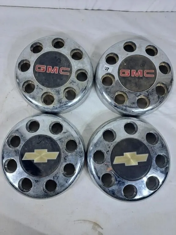 Two Chevrolet and Two GMC Hub Caps