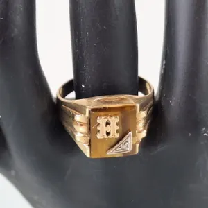 10K Tigers Eye Signet ring with 1 tested diamond.