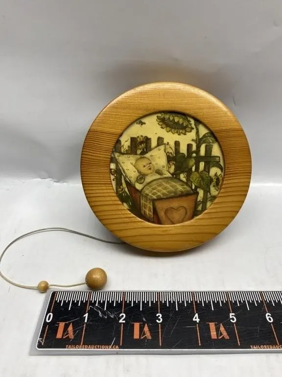 Wood-framed music box with sunflower baby scene