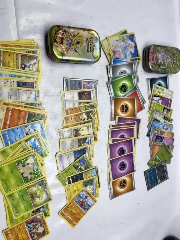 Pokémon TCG card lot with collector tins