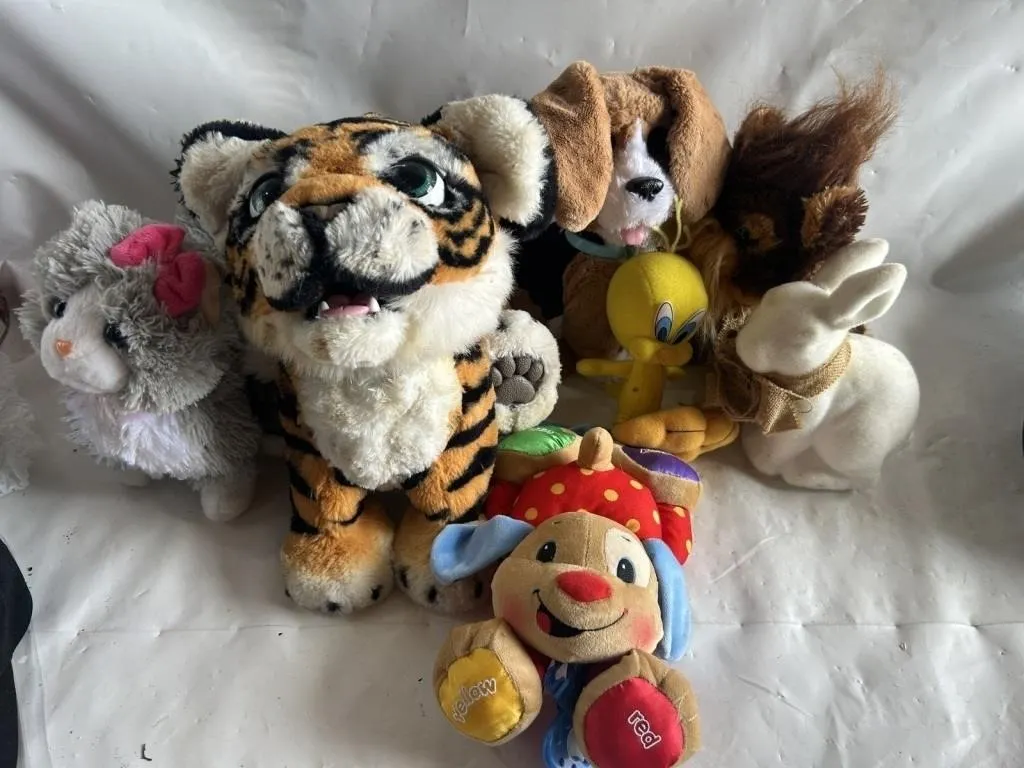 Assorted plush toys: tiger, cat, dog, bunny,