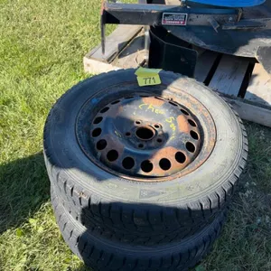 Two 195/60 r15 studded winter tires on steel rims