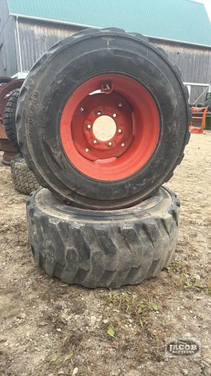 Pair of 12-16.5 tires on Kubota 6 bolt wheels