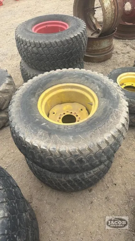 Pair of titan 44x18.00-20 tires on Jd 8 bolt wheels