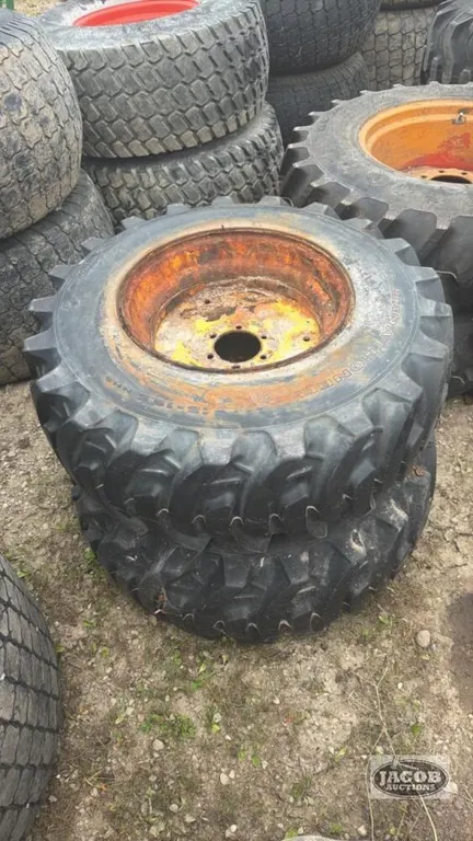 Pair of 15-19.5 tires on Jd 6 bolt wheels