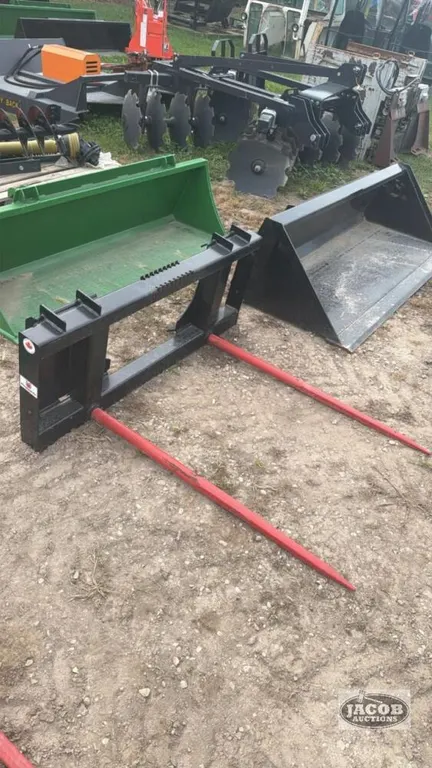 Unused skid steer quick tach 2 prong bale spear