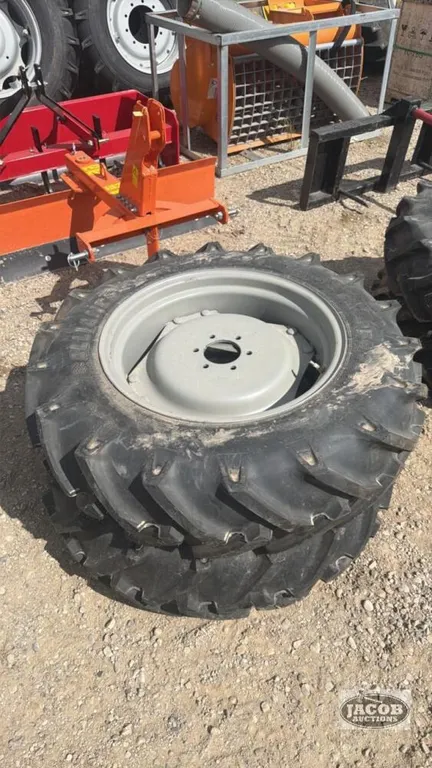 Unused ALliance 11.2 24 tire on 6 bolt wheel x2