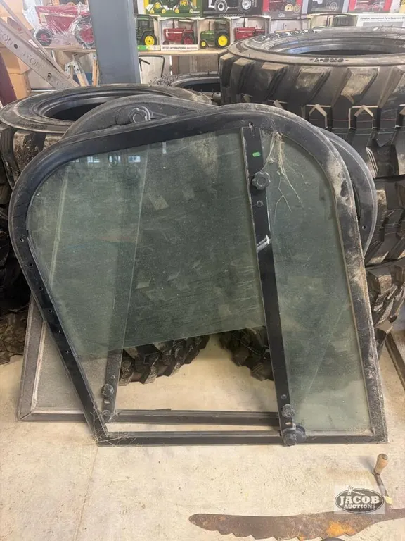 Enclosed side cab windows and frames for Newholland L220 skid steer