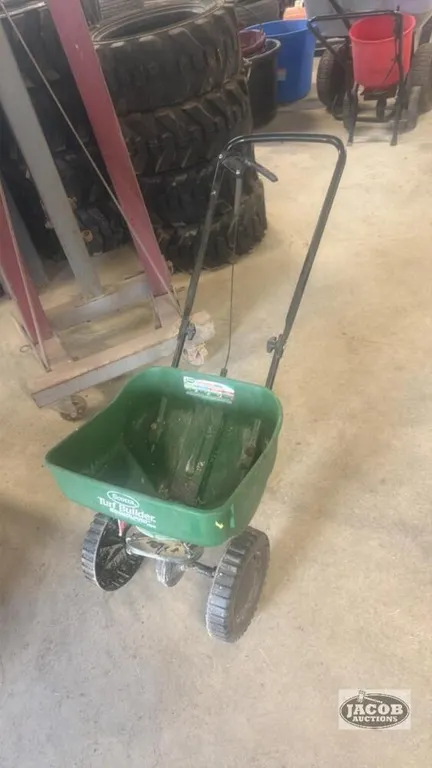 Walk behind grass seed spreader